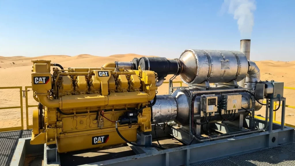 CAT Tier 4 Final diesel engine with emissions control system on UAE oil drilling rig in desert showing DPF and SCR aftertreatment components
